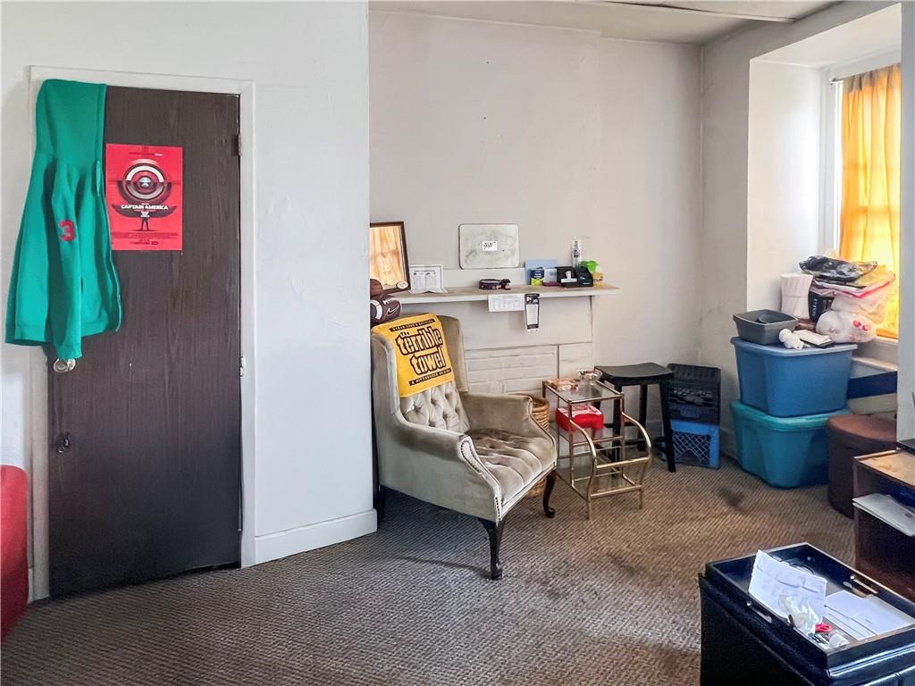 7347 Burton Street Pittsburgh, PA 15218 - Photo 22 of 31 a living room with furniture and a window