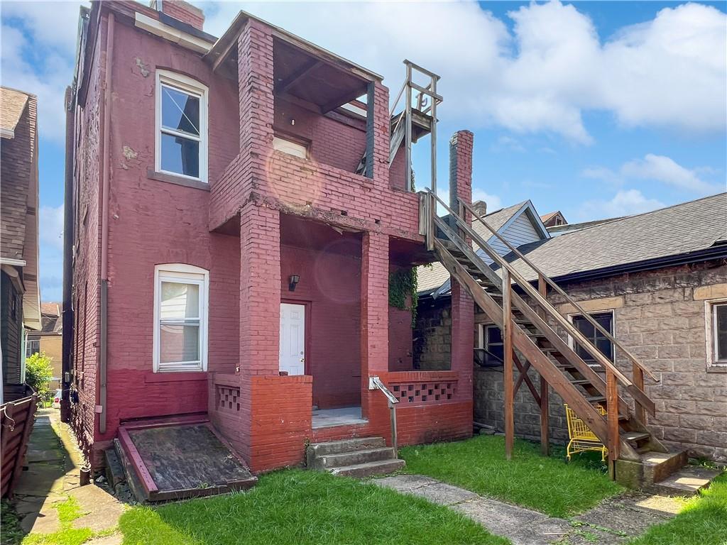 7347 Burton Street Pittsburgh, PA 15218 - Photo 25 of 31 front view of house with a yard