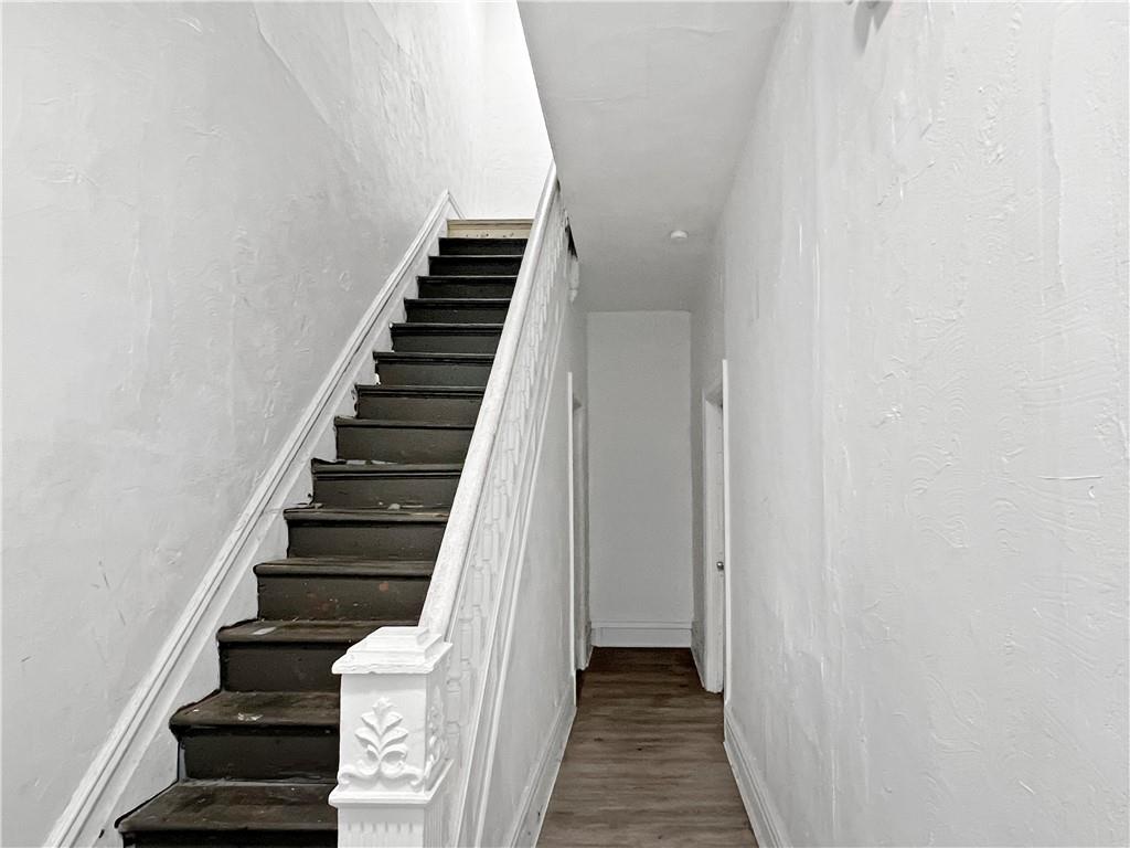 7347 Burton Street Pittsburgh, PA 15218 - Photo 3 of 31 a view of a hallway with wooden floor and entryway