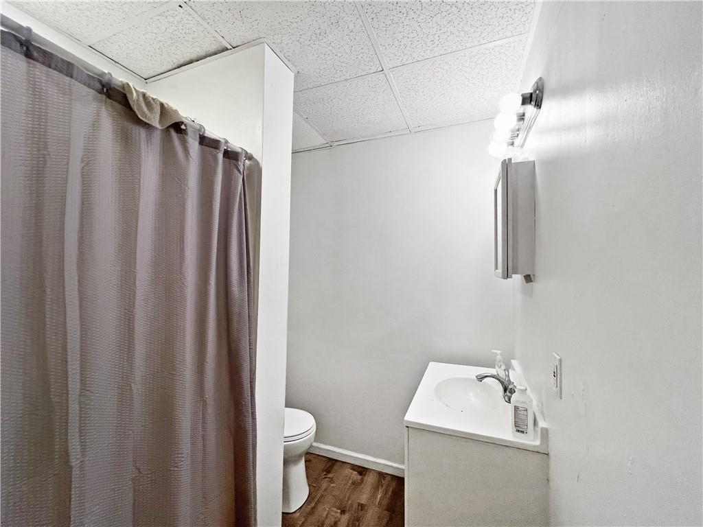 7347 Burton Street Pittsburgh, PA 15218 - Photo 10 of 31 a bathroom with a sink and toilet