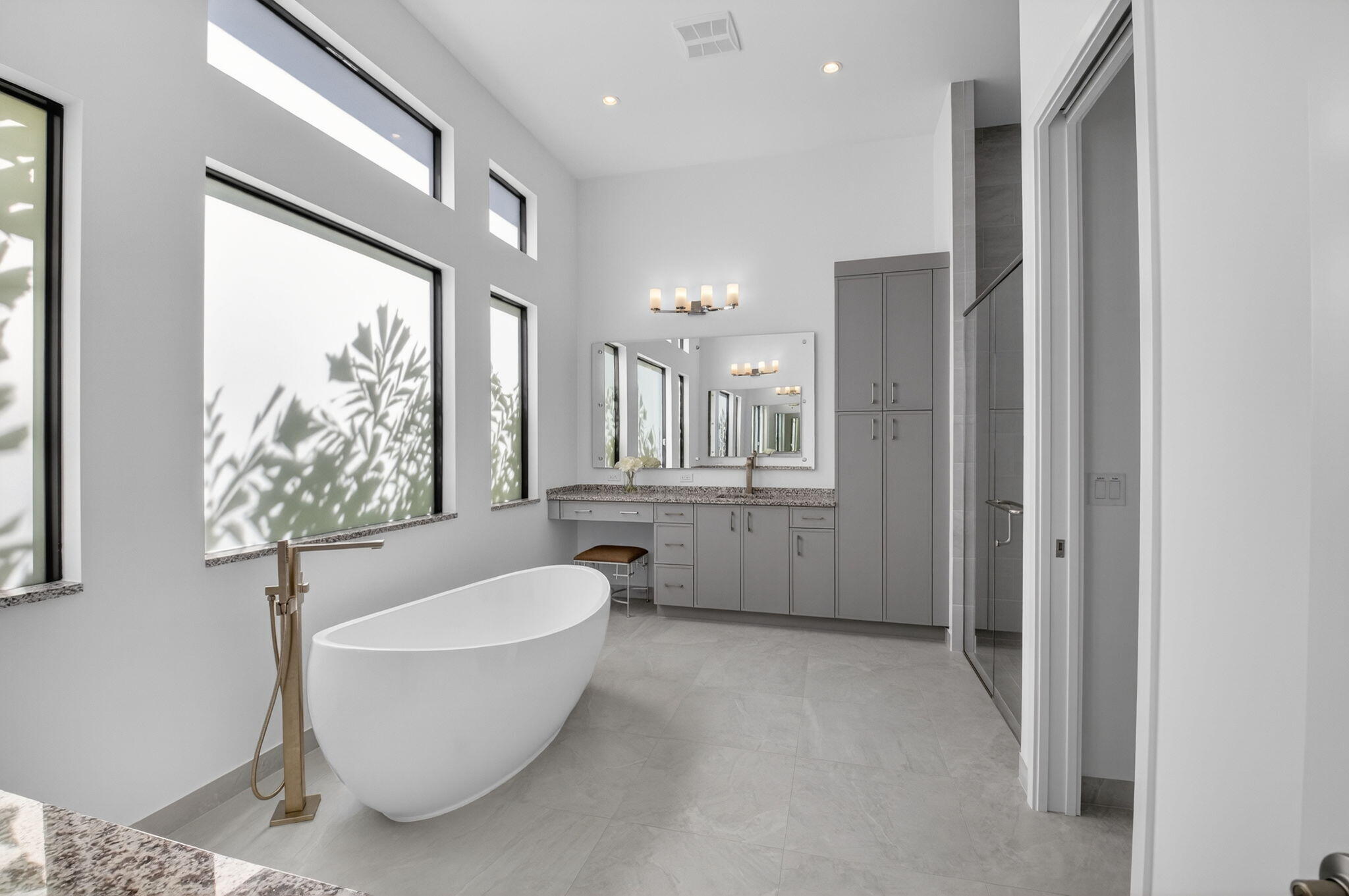 20370 Whistling Straits Way Boca Raton, FL 33434 - Photo 14 of 40 a bathroom with a bathtub and shower