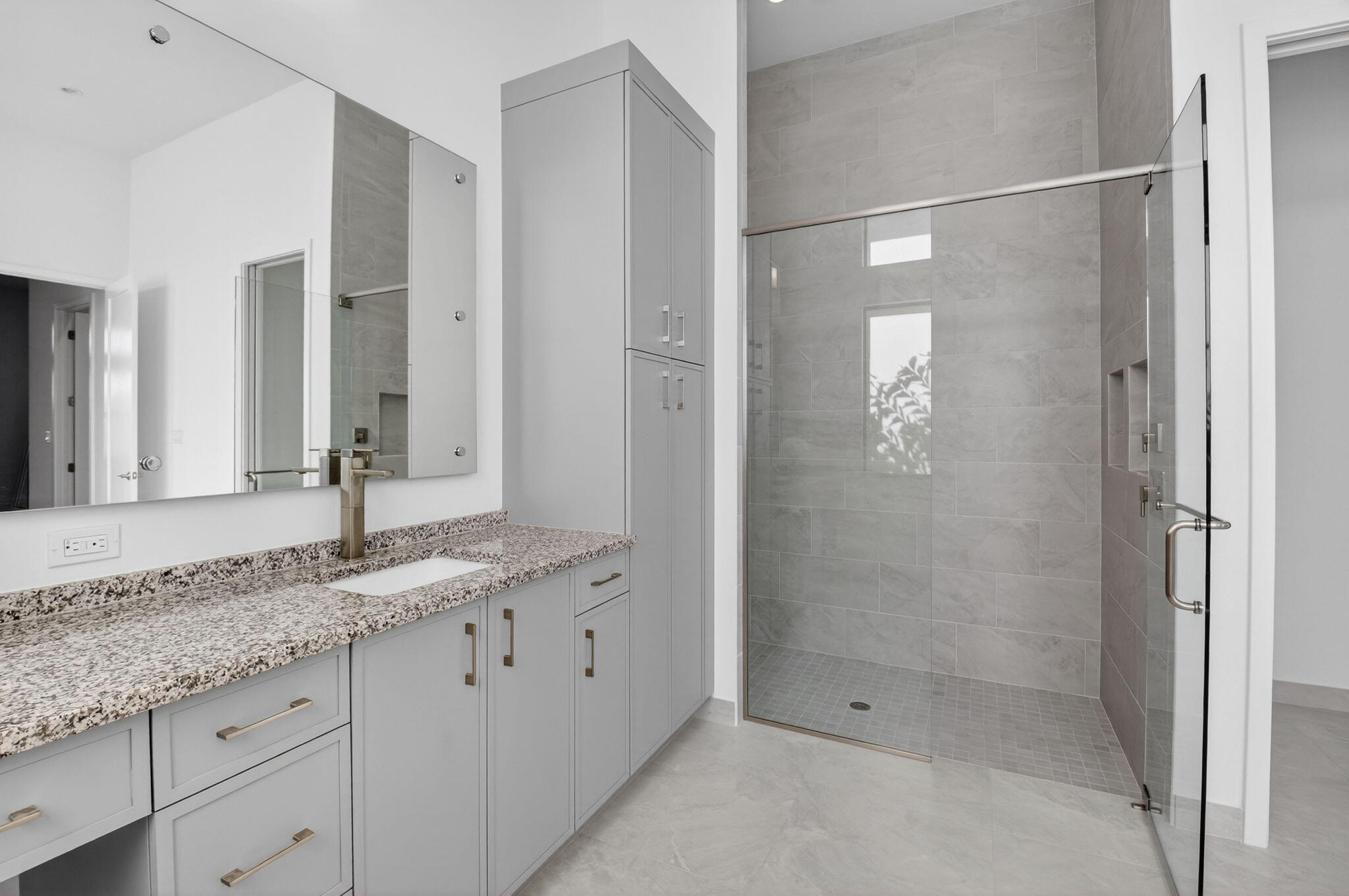20370 Whistling Straits Way Boca Raton, FL 33434 - Photo 15 of 40 a bathroom with a granite countertop sink two mirror and shower