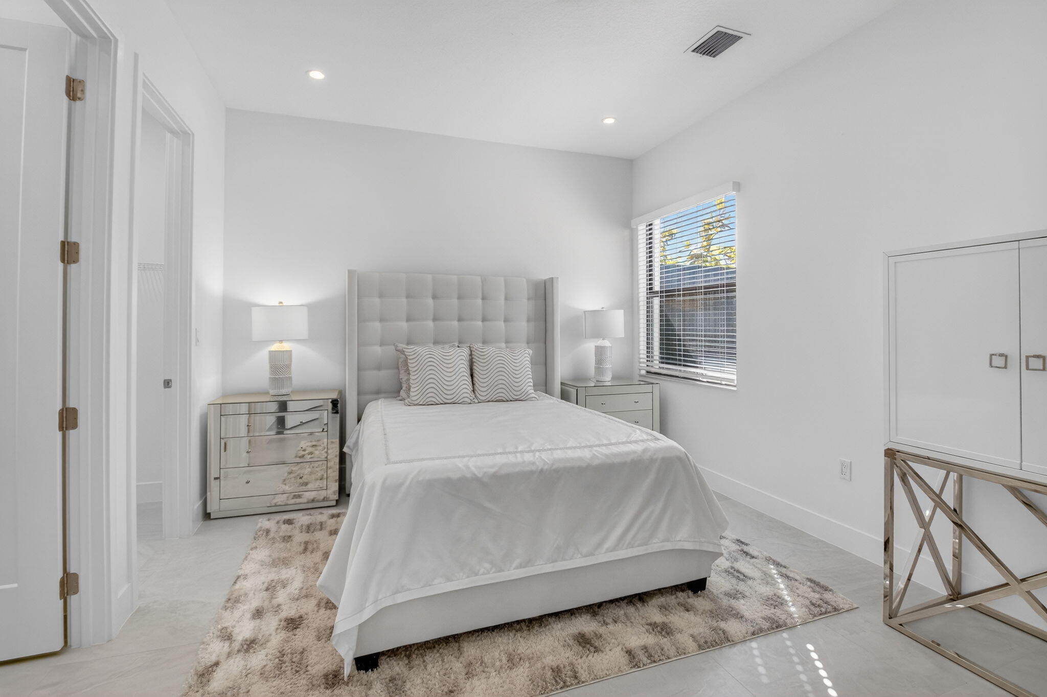 20370 Whistling Straits Way Boca Raton, FL 33434 - Photo 18 of 40 a bedroom with a bed and a window