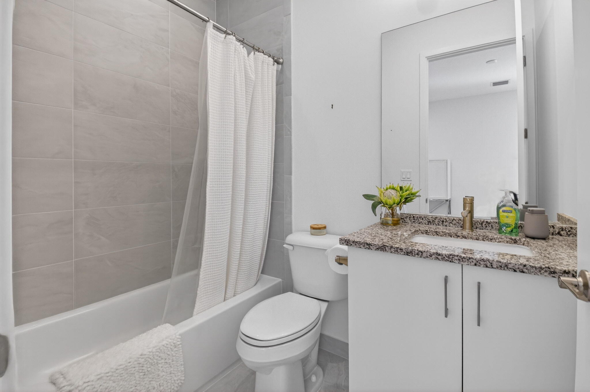 20370 Whistling Straits Way Boca Raton, FL 33434 - Photo 21 of 40 a bathroom with a granite countertop sink and a toilet