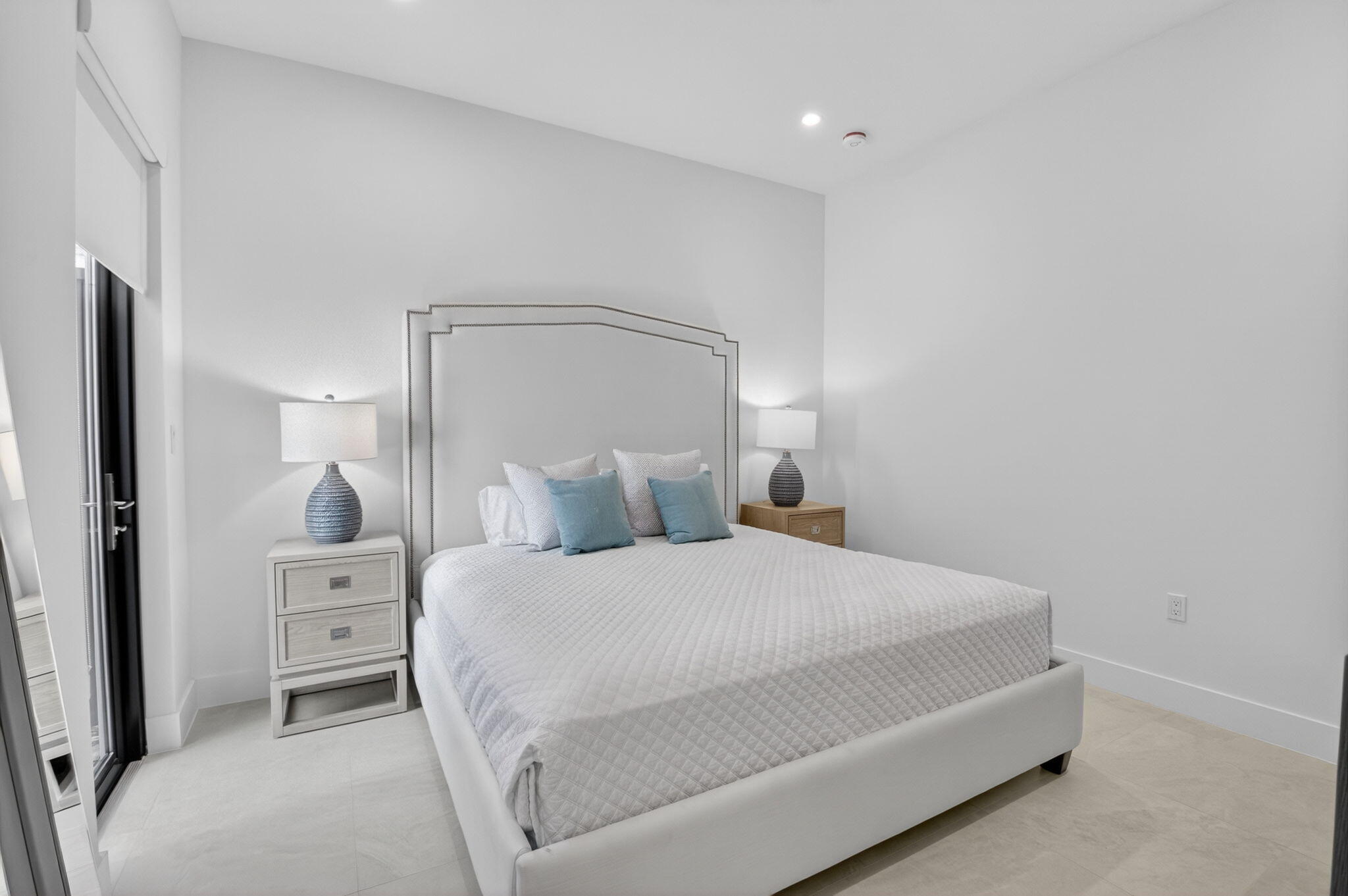20370 Whistling Straits Way Boca Raton, FL 33434 - Photo 24 of 40 a bedroom with a bed and a large mirror