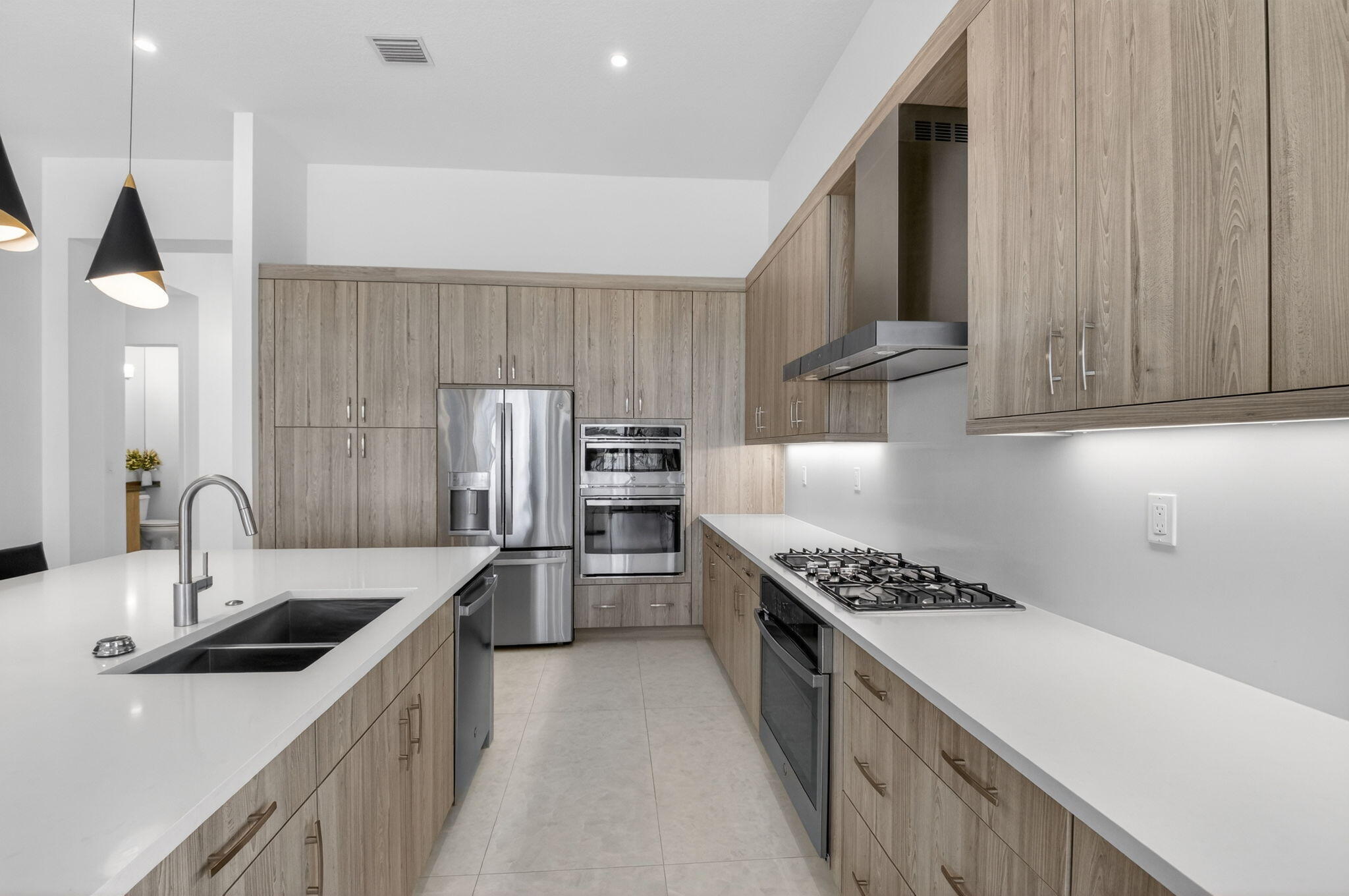 20370 Whistling Straits Way Boca Raton, FL 33434 - Photo 7 of 40 a kitchen with stainless steel appliances granite countertop a sink stove and refrigerator