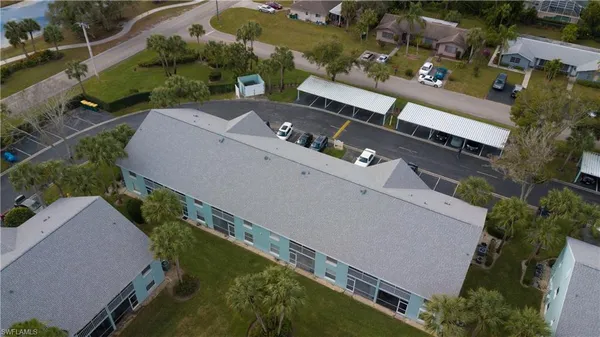an aerial view of a house with a yard