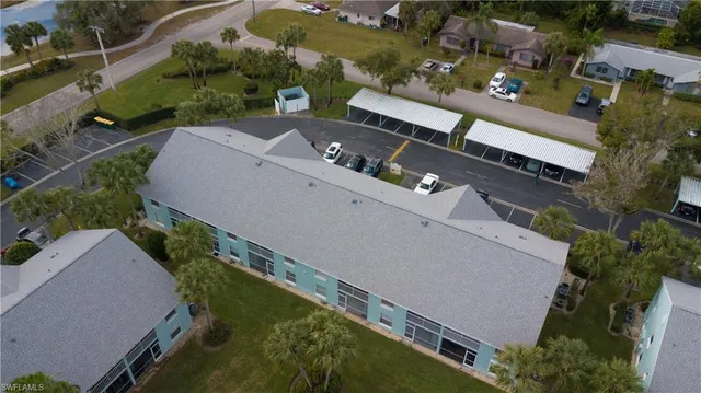 an aerial view of a house with a yard