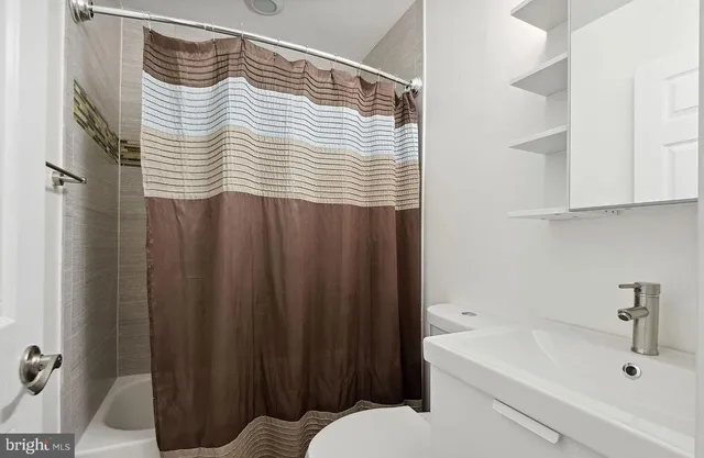 a bathroom with a sink and a bathtub