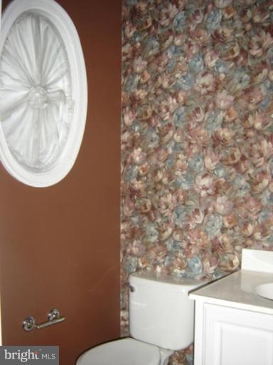 7633 Bear Forest Road Hanover, MD 21076 - Photo 22 of 24 a bathroom with a toilet and a sink