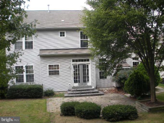 7633 Bear Forest Road Hanover, MD 21076 - Photo 8 of 24 a front view of a house with a garden