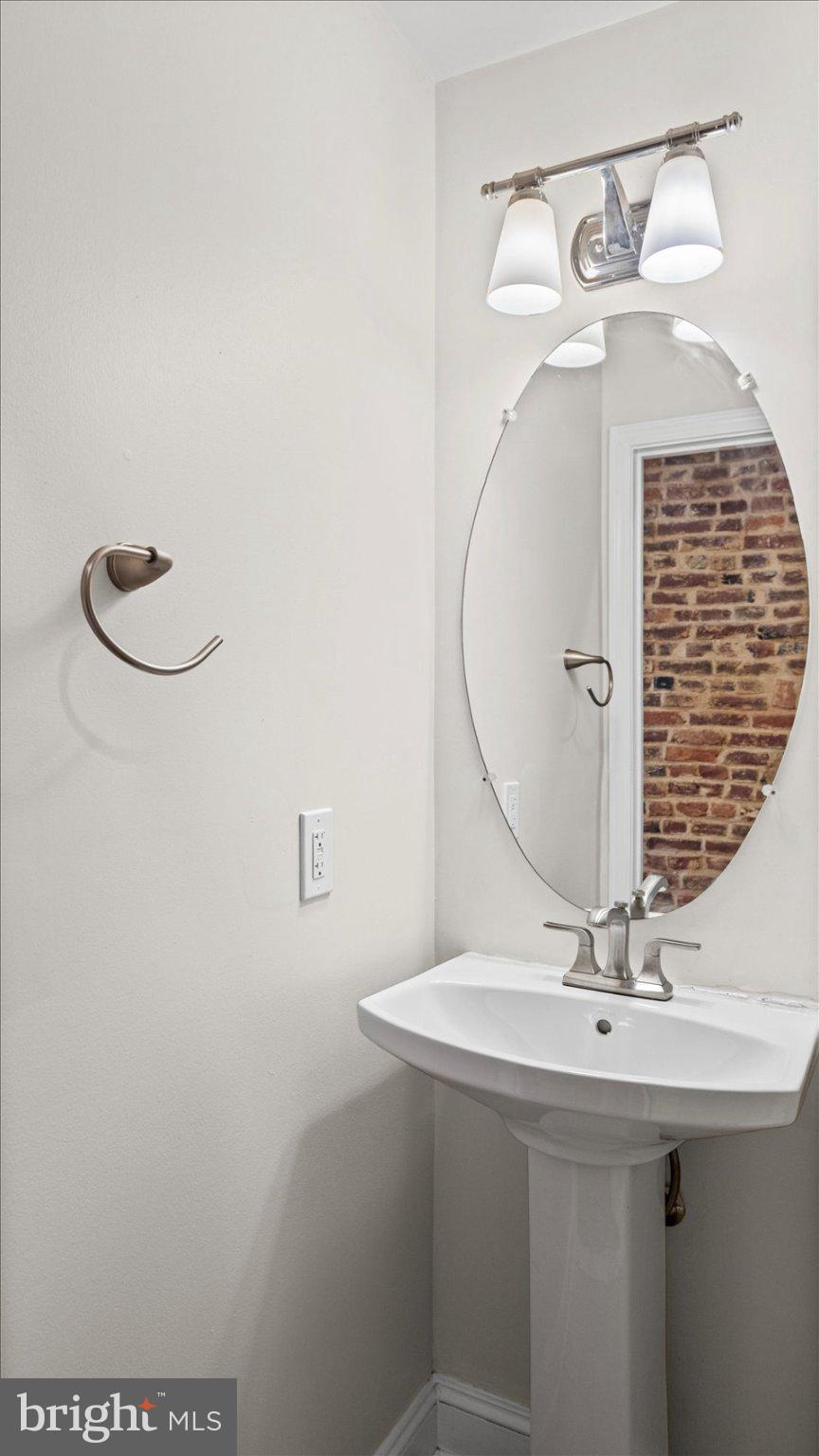 847 Carroll Street Baltimore, MD 21230 - Photo 12 of 33 Chic half-bath with modern accents.