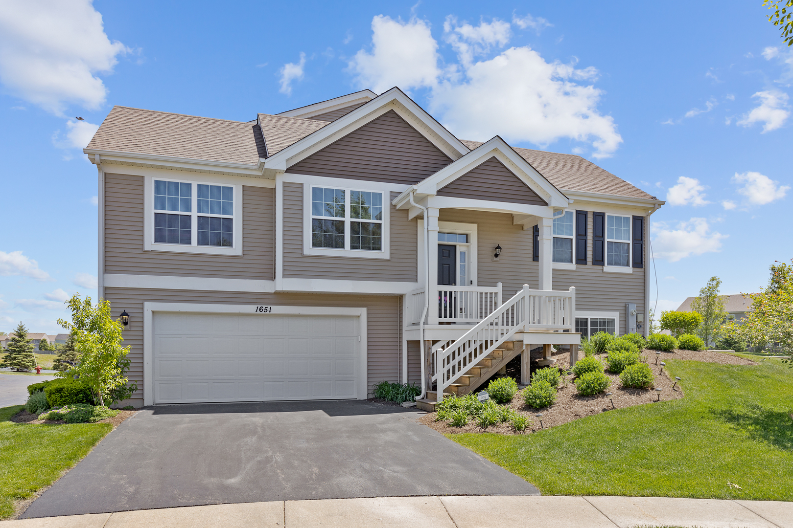 1651 Ruby Drive Pingree Grove, IL 60140 - Photo 1 of 26 front view of a house with a yard