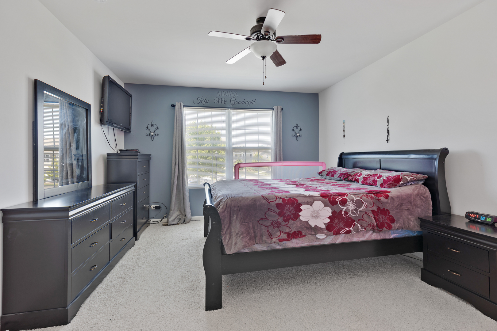 1651 Ruby Drive Pingree Grove, IL 60140 - Photo 16 of 26 a bedroom with a bed dresser and a window