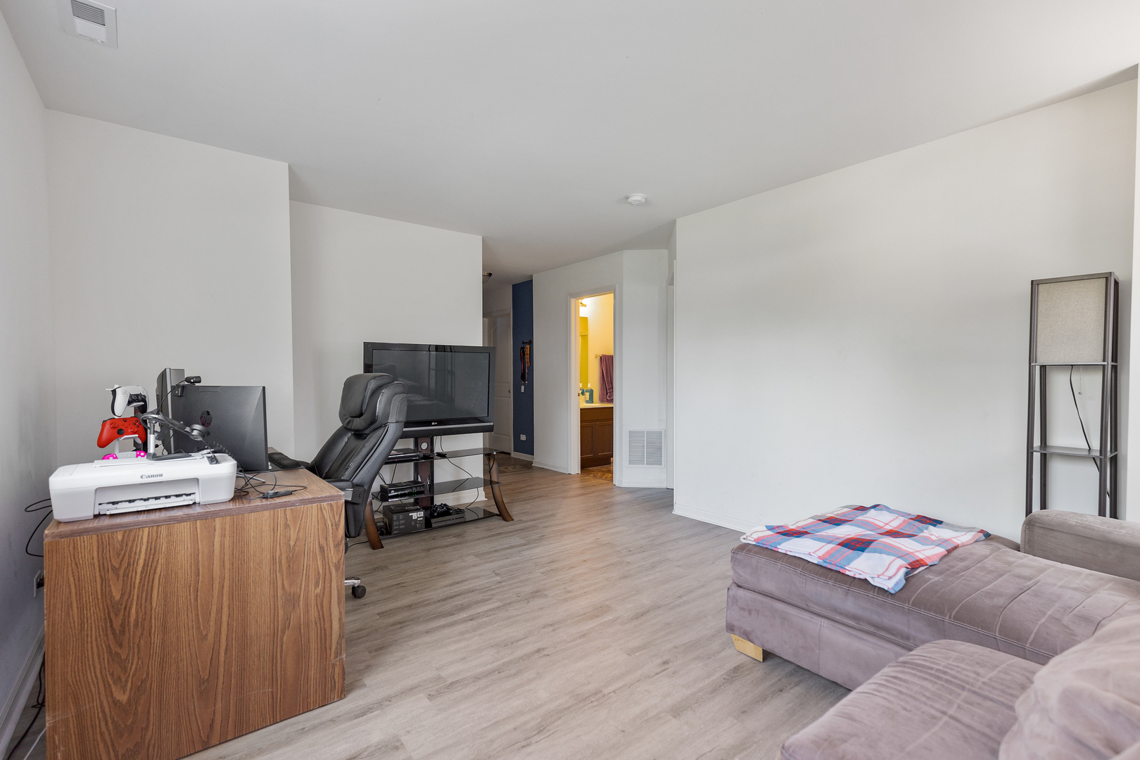 1651 Ruby Drive Pingree Grove, IL 60140 - Photo 20 of 26 a bedroom with furniture and a wooden floor