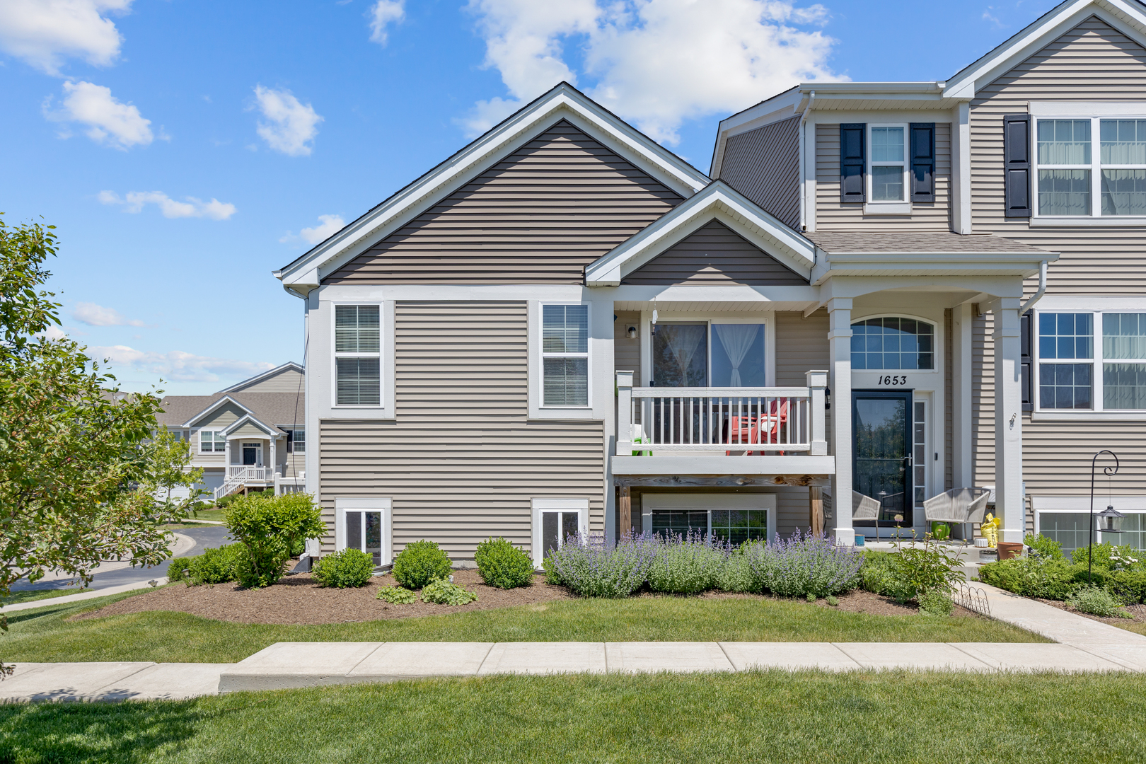 1651 Ruby Drive Pingree Grove, IL 60140 - Photo 24 of 26 a house that has a lot of windows in it