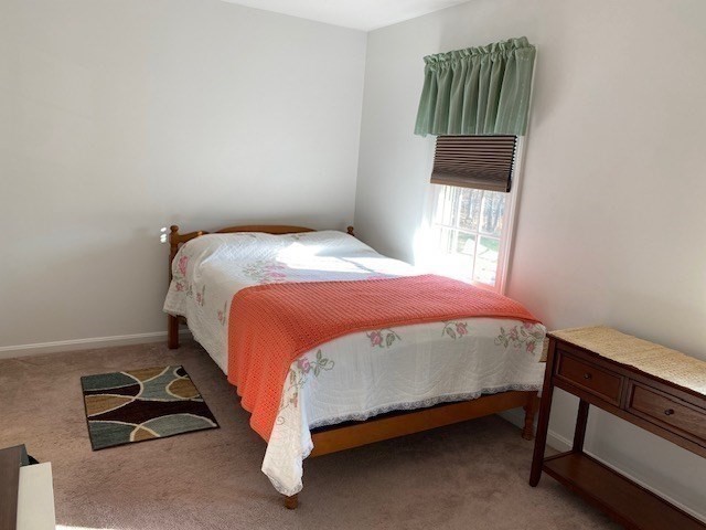 107 Center Depot Road, Unit C Charlton, MA 01507 - Photo 17 of 39 a bedroom with a bed and a window