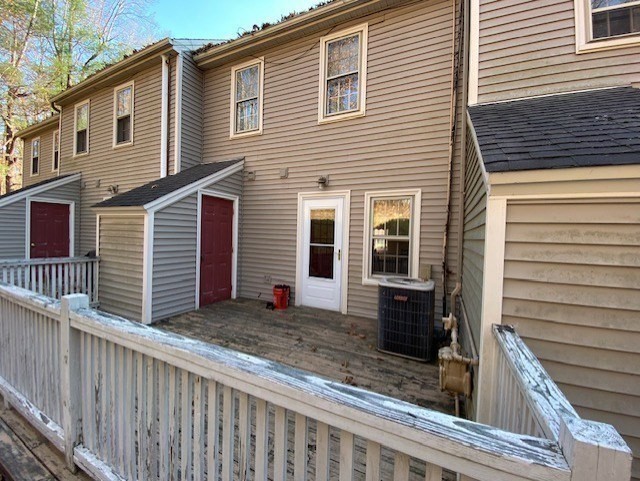 107 Center Depot Road, Unit C Charlton, MA 01507 - Photo 18 of 39 a view of a house with a window and wooden fence