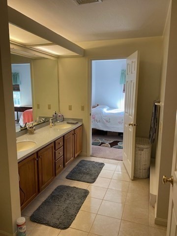 107 Center Depot Road, Unit C Charlton, MA 01507 - Photo 20 of 39 a bathroom with a sink a toilet and mirror