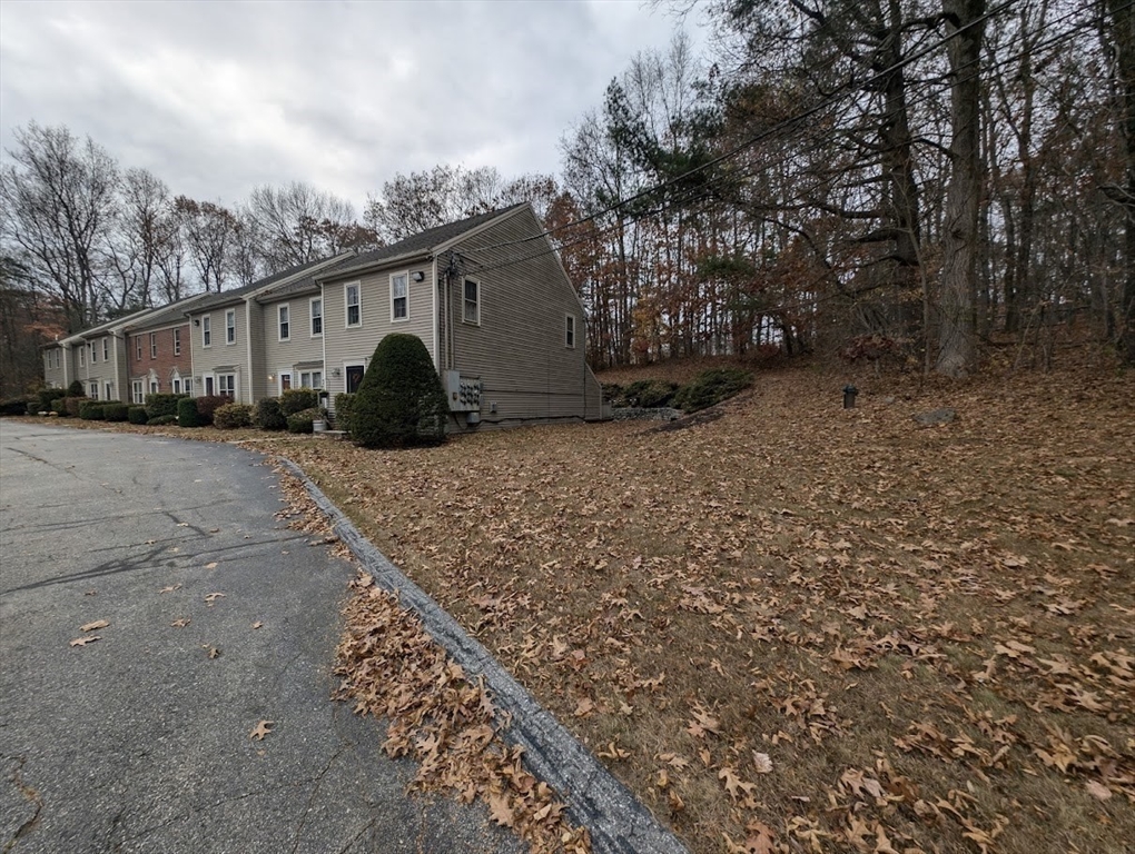 107 Center Depot Road, Unit C Charlton, MA 01507 - Photo 26 of 39 a front view of a house with garden