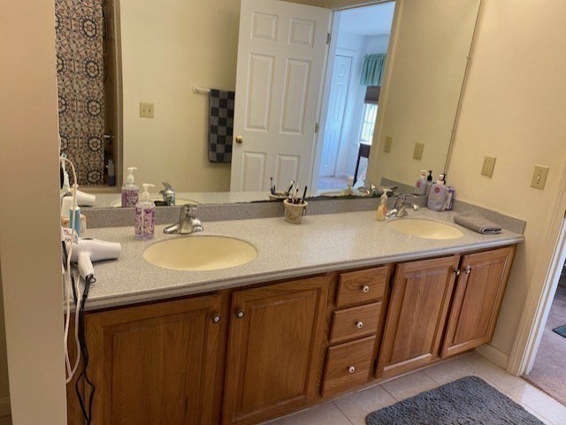 107 Center Depot Road, Unit C Charlton, MA 01507 - Photo 28 of 39 a bathroom with a double vanity sink and a mirror