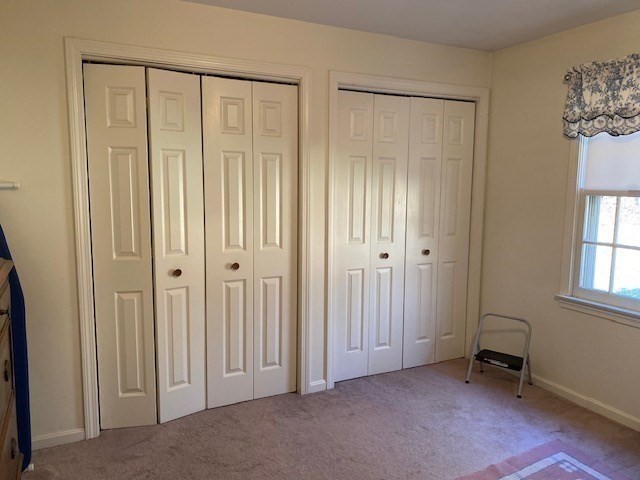 107 Center Depot Road, Unit C Charlton, MA 01507 - Photo 29 of 39 an empty room with windows and closet area