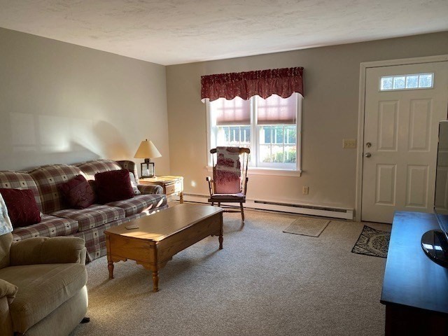 107 Center Depot Road, Unit C Charlton, MA 01507 - Photo 3 of 39 a living room with furniture and a window