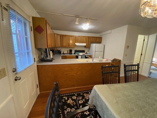 107 Center Depot Road, Unit C Charlton, MA 01507 - Photo 5 of 39 a kitchen with sink refrigerator and cabinets