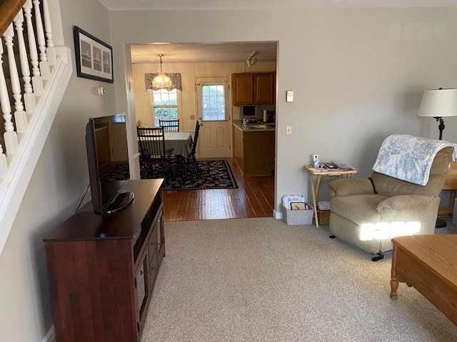 107 Center Depot Road, Unit C Charlton, MA 01507 - Photo 8 of 39 a living room with furniture and a flat screen tv
