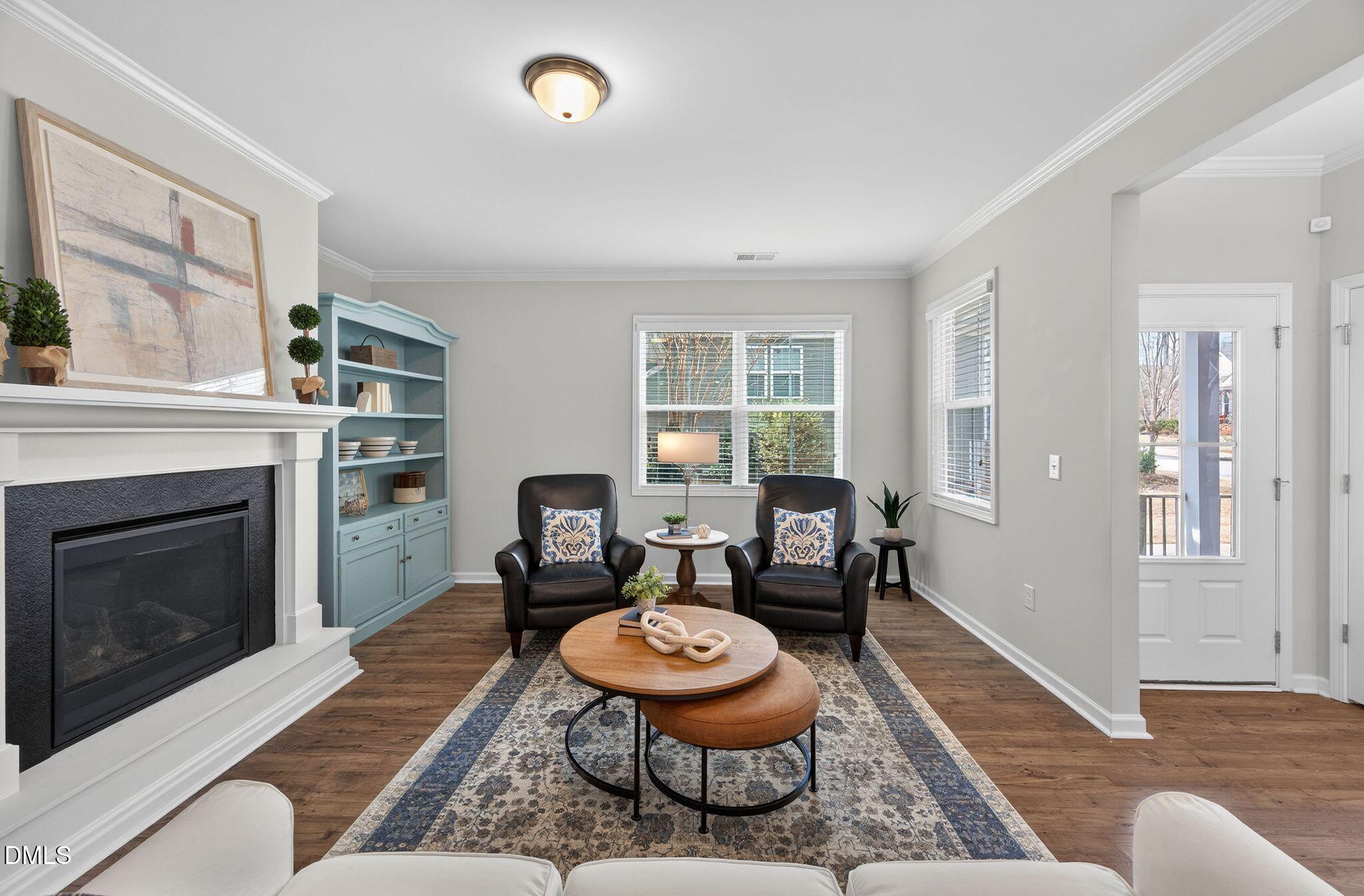 528 Spring Flower Court Cary, NC 27511 - Photo 9 of 51 a living room with furniture and a fireplace