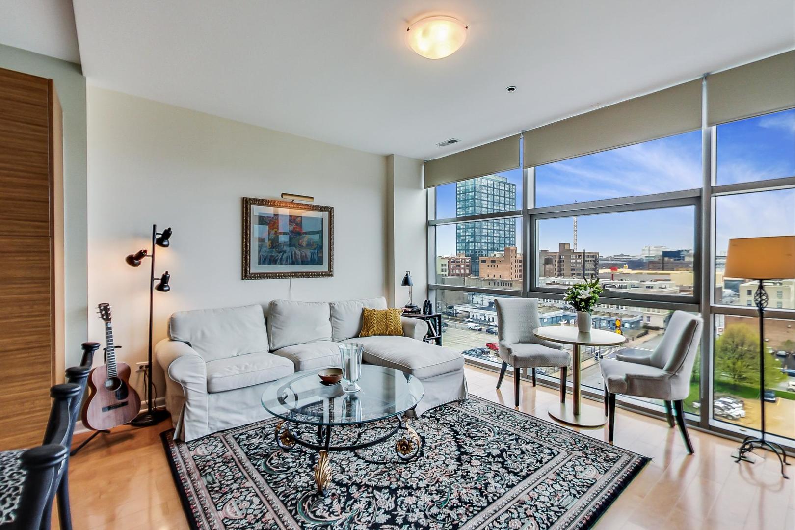 225 South Sangamon Street, Unit 809 Chicago, IL 60607 - Photo 18 of 34 a living room with furniture and a floor to ceiling window