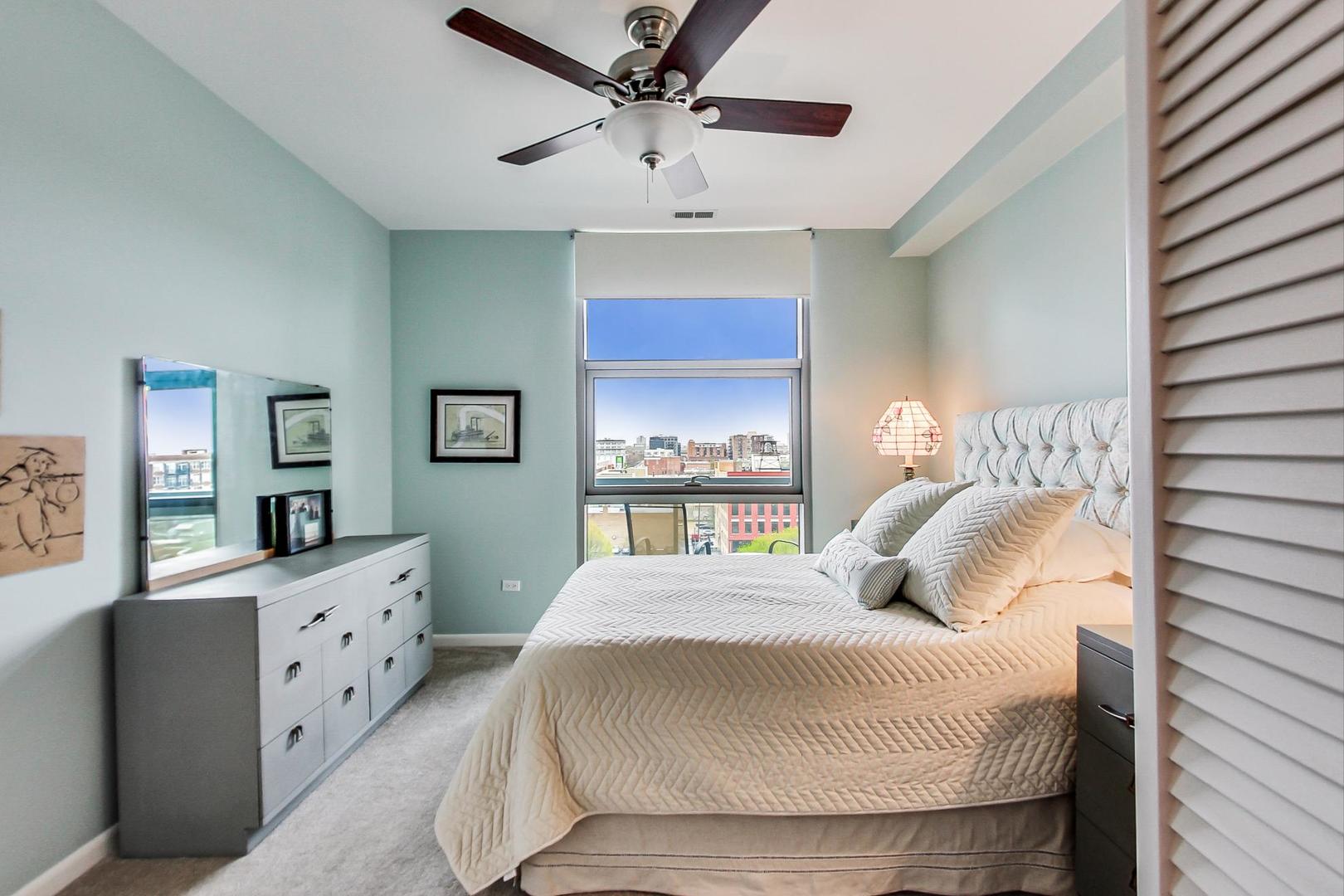 225 South Sangamon Street, Unit 809 Chicago, IL 60607 - Photo 27 of 34 a bedroom with a large bed and a window