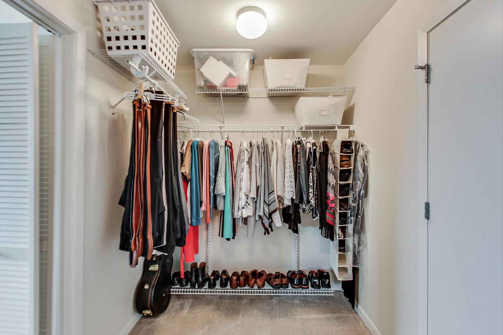 225 South Sangamon Street, Unit 809 Chicago, IL 60607 - Photo 31 of 34 a view of walk in closet with clothes and shoes