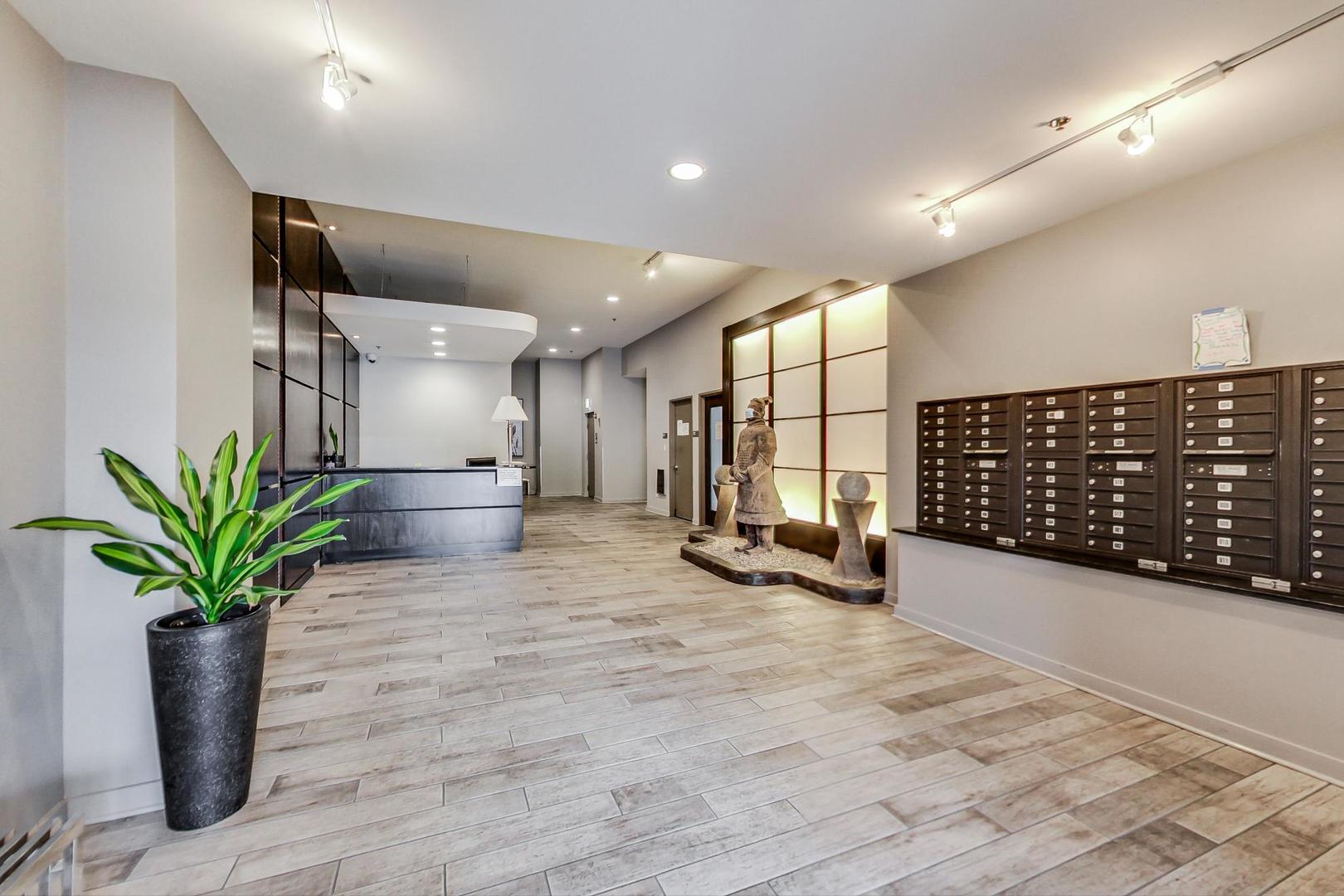 225 South Sangamon Street, Unit 809 Chicago, IL 60607 - Photo 5 of 34 a view of an empty room with a potted plant and windows