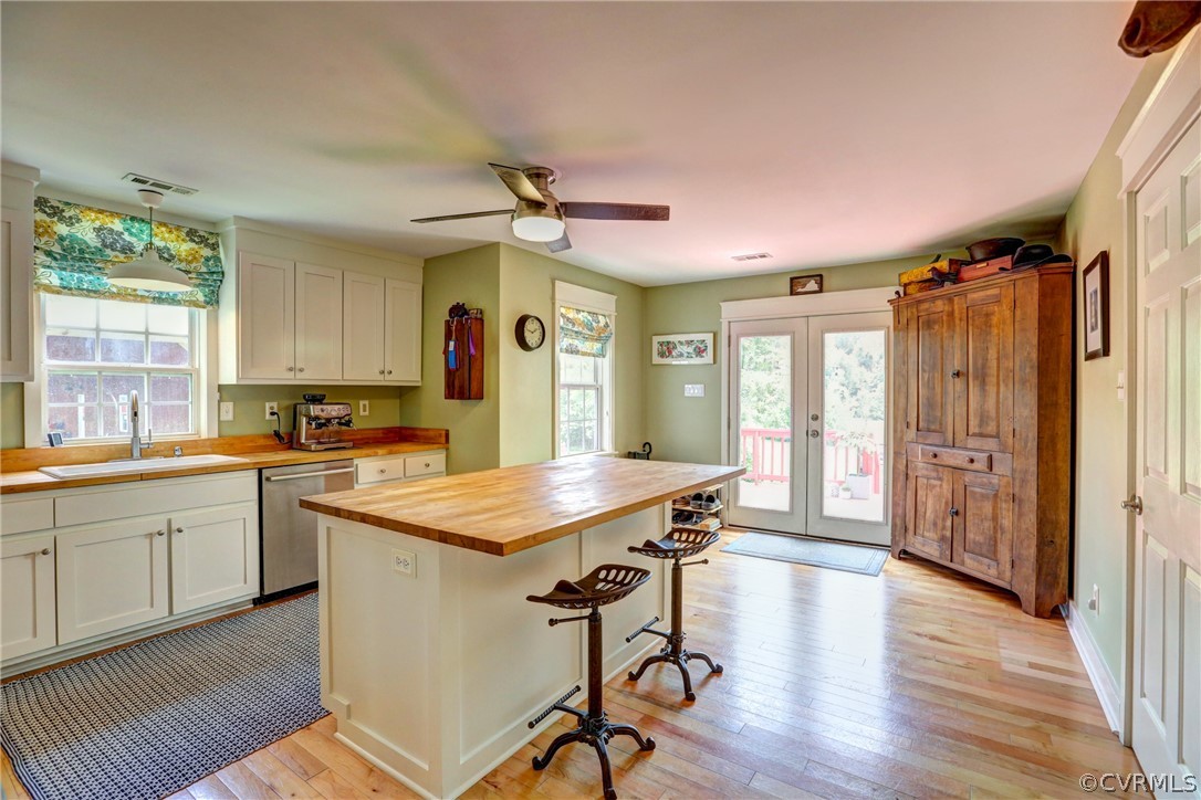 5226 North Warriner Road Richmond, VA 23231 - Photo 14 of 50 a kitchen with a table chairs refrigerator and cabinets