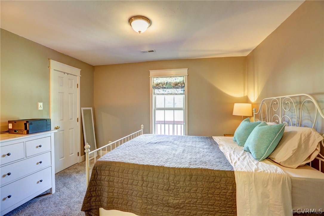 5226 North Warriner Road Richmond, VA 23231 - Photo 17 of 50 a bedroom with a bed and a window