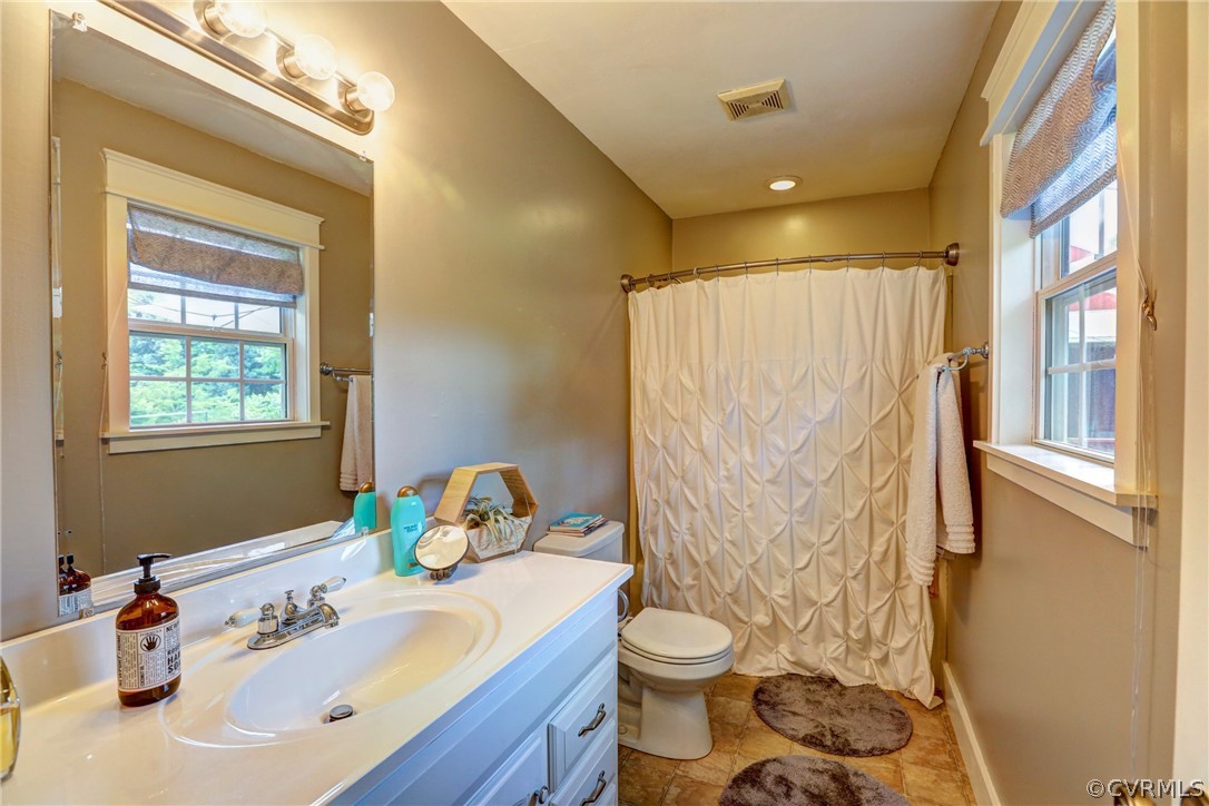 5226 North Warriner Road Richmond, VA 23231 - Photo 25 of 50 a bathroom with a sink toilet and shower