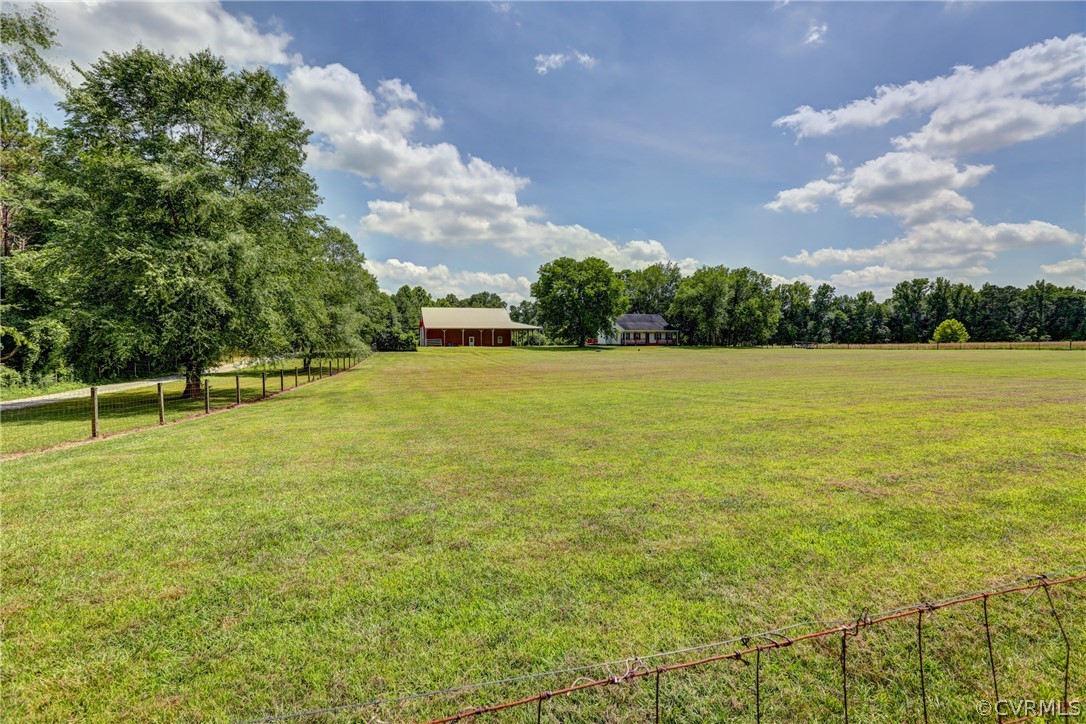 5226 North Warriner Road Richmond, VA 23231 - Photo 3 of 50 a view of yard with swimming pool and trees in the background