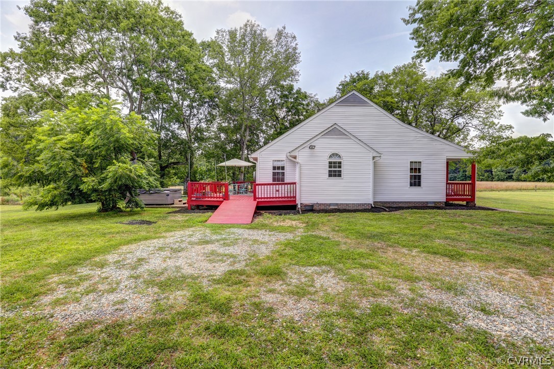 5226 North Warriner Road Richmond, VA 23231 - Photo 34 of 50 a view of backyard of house with wooden fence and trees