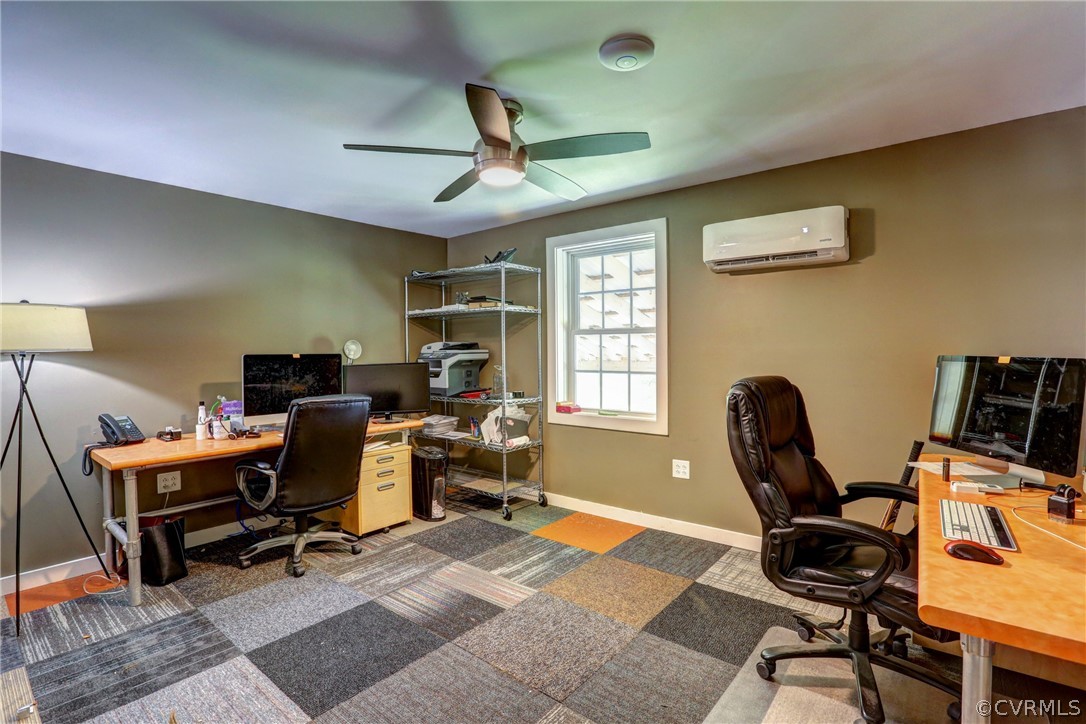 5226 North Warriner Road Richmond, VA 23231 - Photo 41 of 50 a view of a workspace with furniture and a window