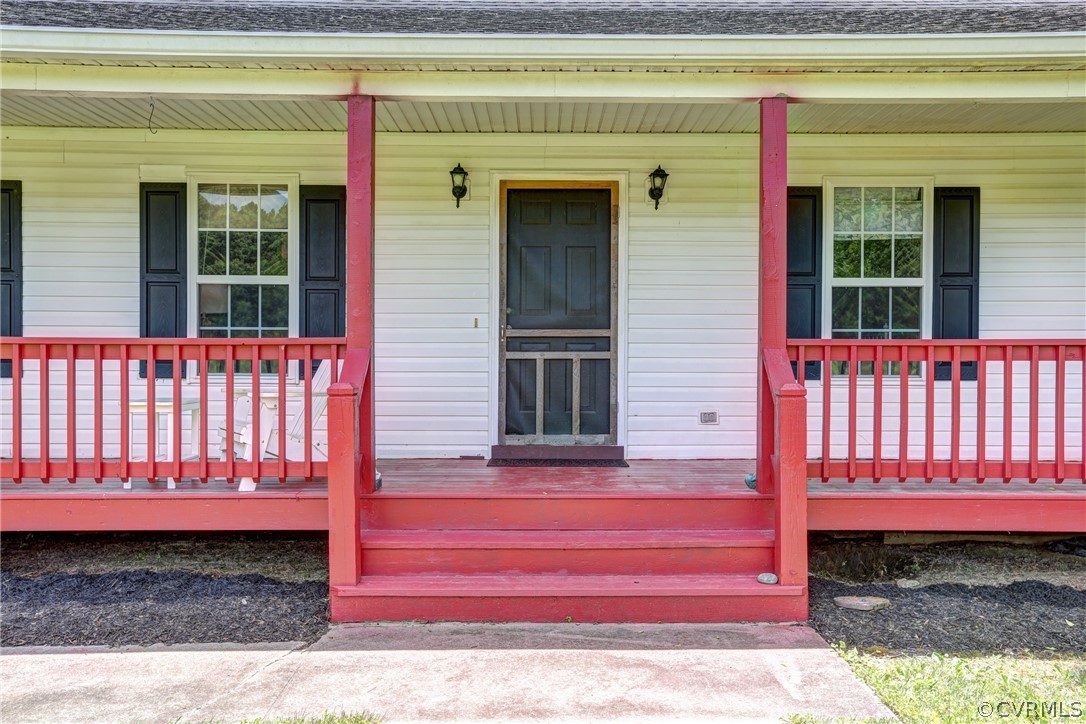 5226 North Warriner Road Richmond, VA 23231 - Photo 6 of 50 a view of a house with a small yard and wooden fence