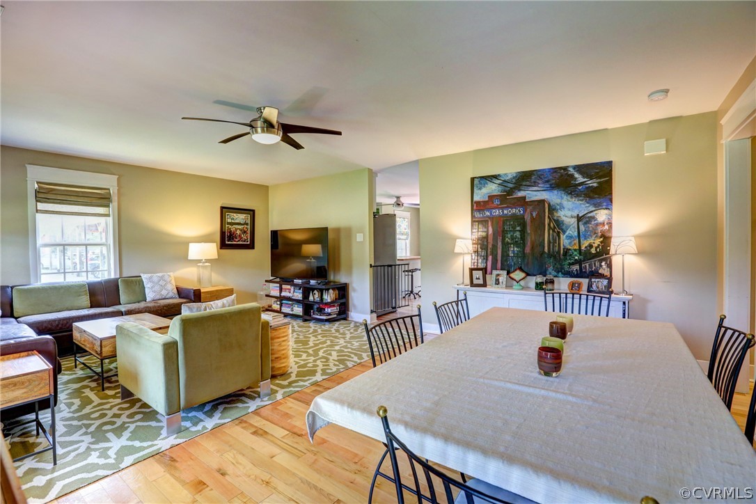 5226 North Warriner Road Richmond, VA 23231 - Photo 8 of 50 a living room with furniture a flat screen tv and kitchen view