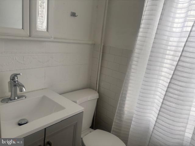 5630 Walnut Street, Unit 2 Philadelphia, PA 19139 - Photo 14 of 28 a bathroom with a sink a toilet and shower