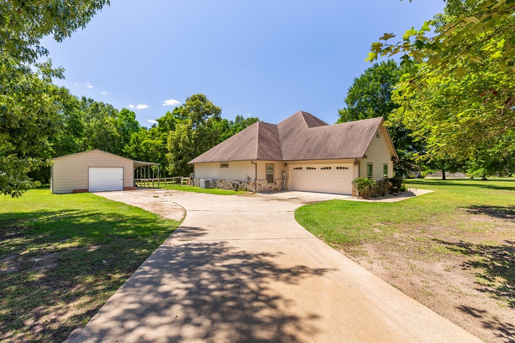 1171 Old Ewing Road Lufkin, TX 75901 - Photo 37 of 49 a house view with a garden space