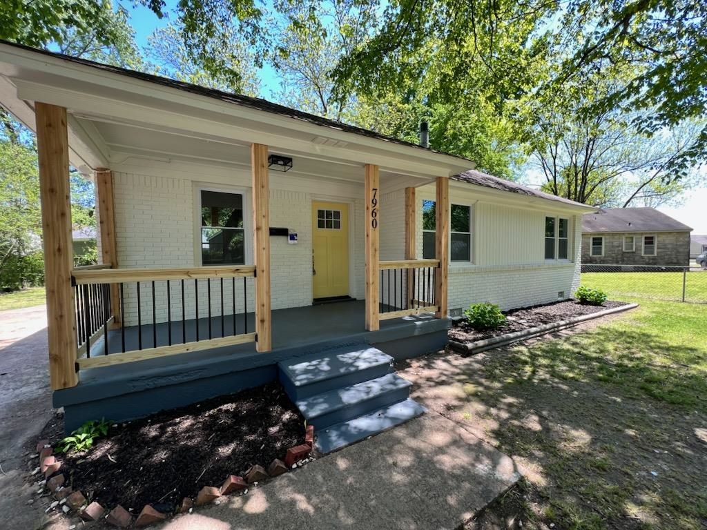 7960 Martha Road Millington, TN 38053 - Photo 1 of 9 a view of a house with a small yard and wooden fence