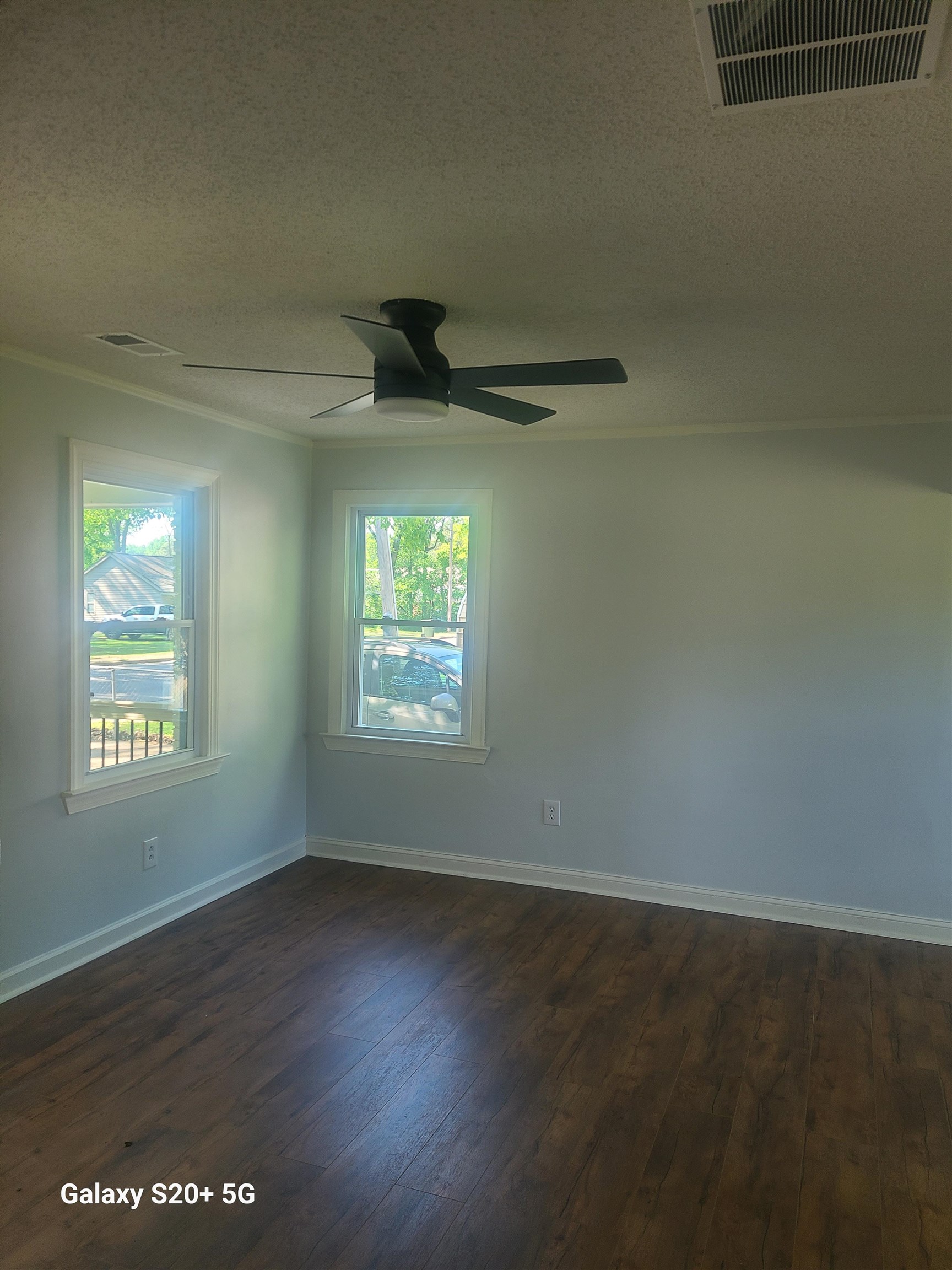 7960 Martha Road Millington, TN 38053 - Photo 6 of 9 an empty room with wooden floor and windows