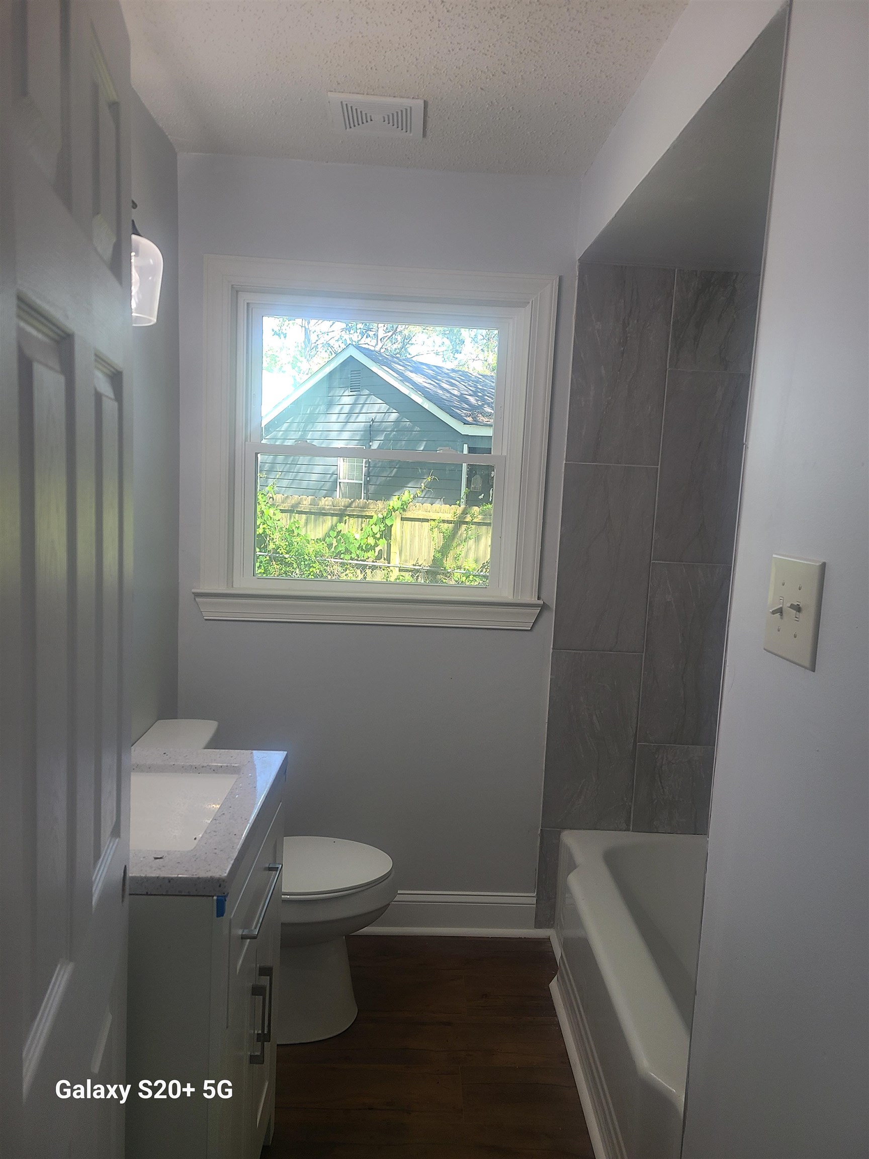 7960 Martha Road Millington, TN 38053 - Photo 8 of 9 a bathroom with a toilet a sink and a bathtub