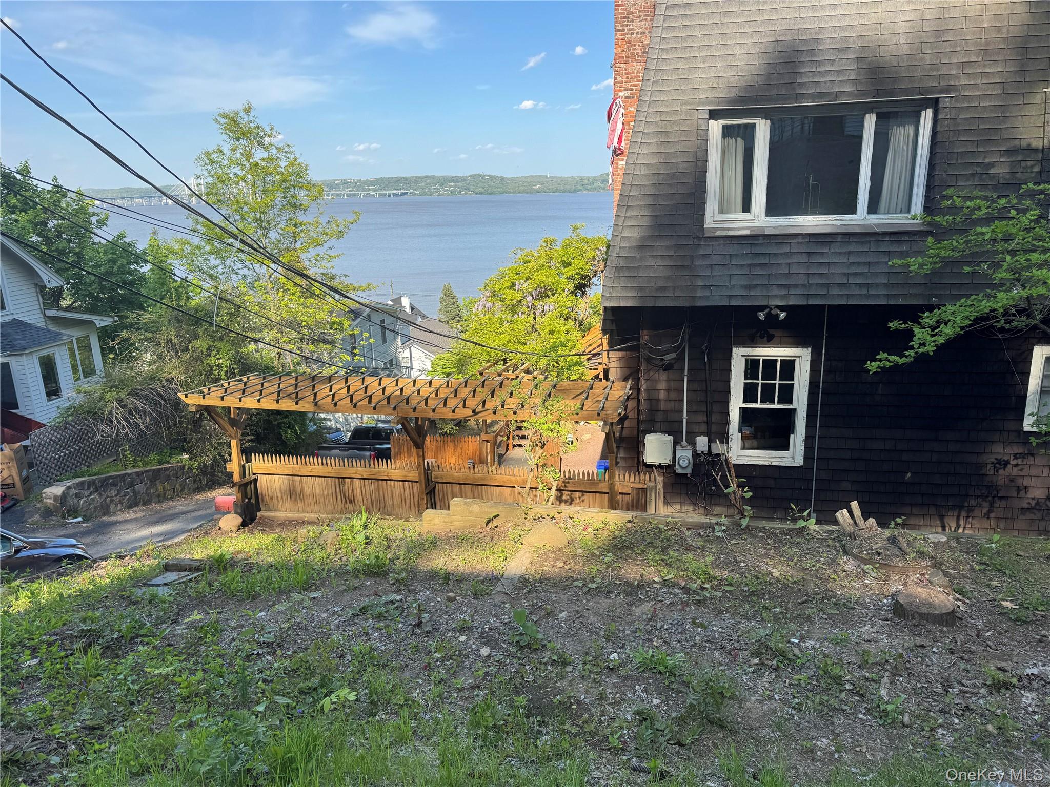 45 Upper Ritie Street Piermont, NY 10968 - Photo 15 of 30 a backyard of a house with table and chairs
