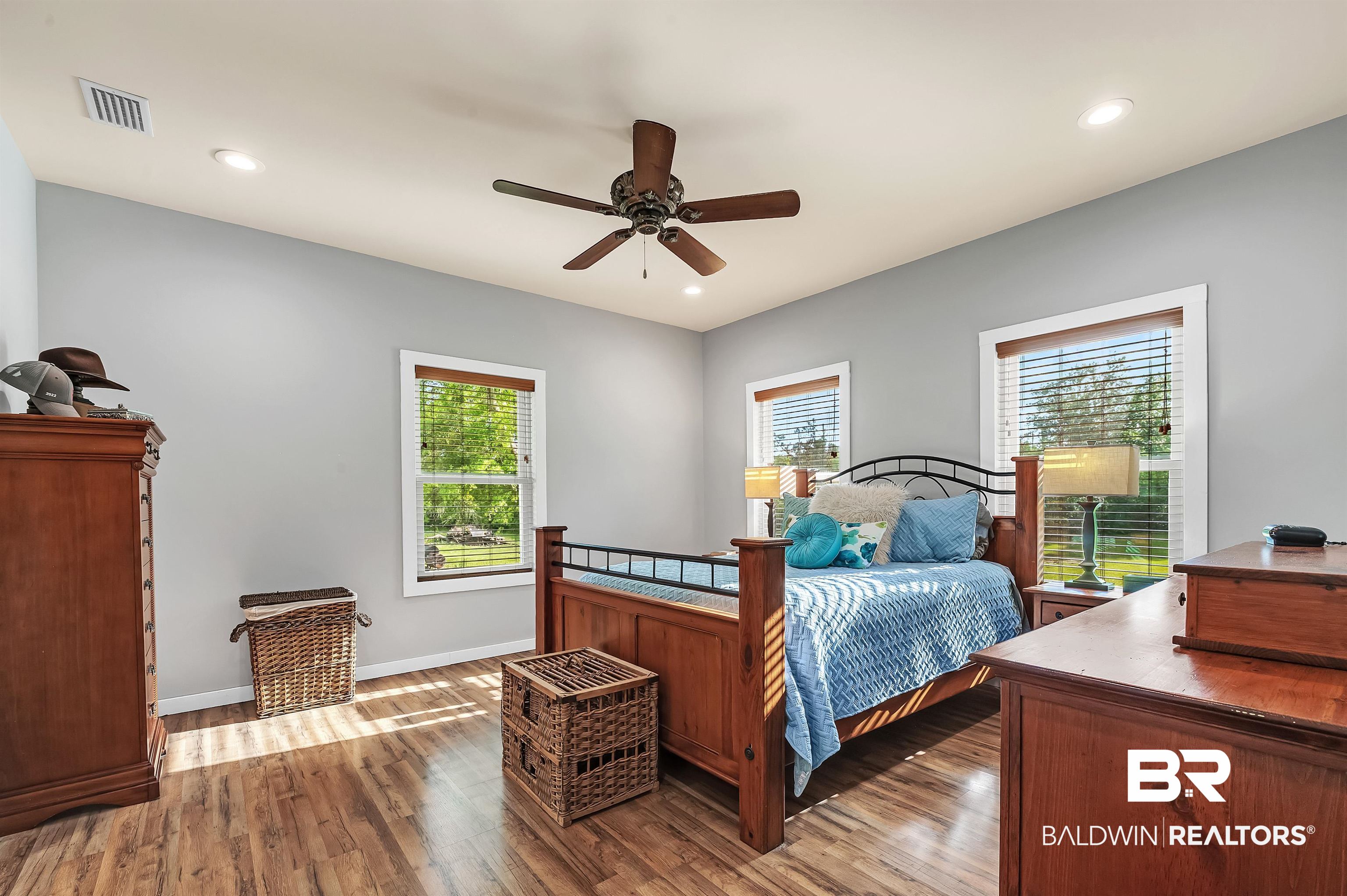 13827 County Road 83 Elberta, AL 36530 - Photo 24 of 38 Bedroom featuring multiple windows, wood finished floors, baseboards, and recessed lighting