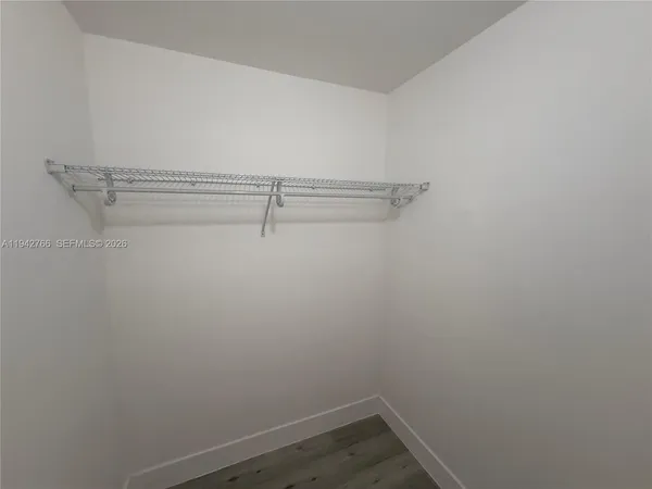 a view of a room with racks on the wall